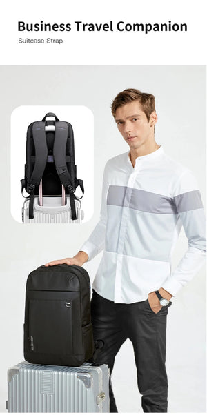 Black business travel backpack with padded shoulder straps and top handle