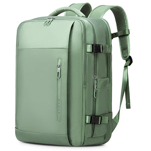 Mint green travel backpack with front buckle straps, side pocket zips, and top handle