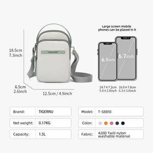 Light gray compact crossbody bag with top handle and adjustable shoulder strap