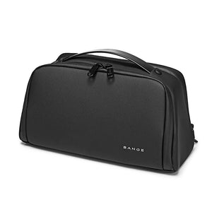 Black waterproof toiletry bag with top handle, smooth zip closure, and logo on front.
