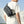 Waterproof crossbody bag worn across the back in dark gray with adjustable strap