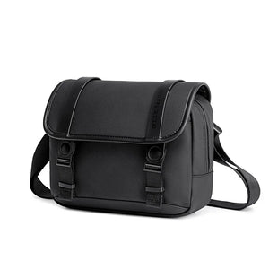Black compact waterproof cross-body bag with flap and two front buckles