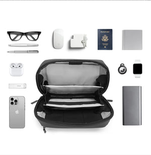 Black tech storage bag with open interior layout and travel accessories