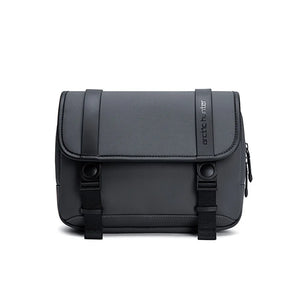 Compact crossbody bag with front flap, two buckled straps, side zipper, dark