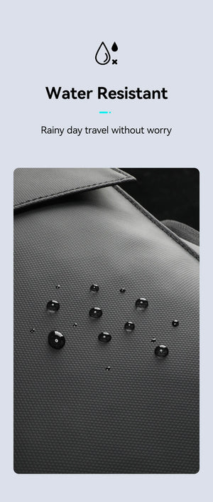 Water-resistant dark grey backpack fabric close-up with water droplets texture