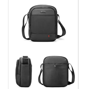 Compact waterproof messenger bag in black with top handle and adjustable shoulder strap