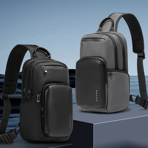 Two compact crossbody bags in grey and black with front zip pocket and straps
