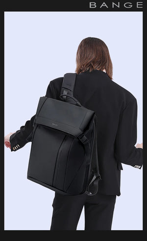 Black backpack worn from behind with top handle, shoulder straps, and back panel.