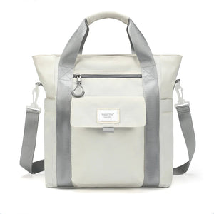 Light beige waterproof tote backpack with front flap pocket and adjustable shoulder strap