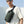 Minimalist sling bag worn across the chest with dark green adjustable strap