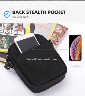 Black crossbody messenger bag with back stealth pocket and front phone storage opening