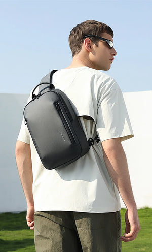 Lightweight waterproof crossbody bag, black, back view with shoulder strap