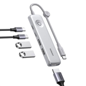 Ugreen USB hub with multiple ports and cables on a white background