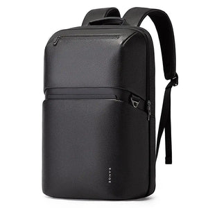 Black leather-look laptop backpack with front pocket, zipper, and adjustable shoulder straps