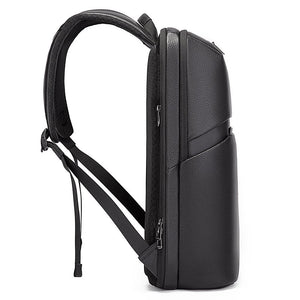 Black laptop backpack with adjustable shoulder straps and side zipper pocket